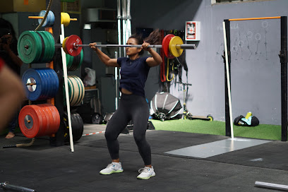 Athlete lifting a barbell in a CrossFit Yuva listing photo